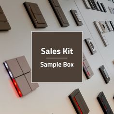 sales kit sample box displayed on wall with magnets and letters in the back ground