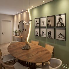 a dining room table with chairs and pictures on the wall