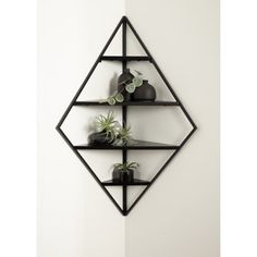 three shelves with plants on them against a wall in the shape of a hexagonal pyramid