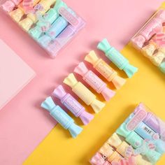 pastel colored baby shower products are lined up on a yellow and pink background