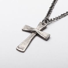 This Vintage Style Cross is handmade of solid Sterling Silver (92.5% pure silver) in my studio. The cross is hand hammered and I use a dark patina to bring out the details and give it the worn out look of time. Cross Height: 1 1/2 inches (4 cm) Width: 1 inch (2.5cm) Necklace chain: choose your length and material