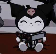 a cartoon character sitting on the floor reading a book