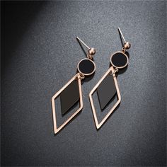 These drop earrings feature a geometric shape and a lustrous two-tone design. 1.06" W x 2.28" L 18k rose gold-plated stainless steel / acrylic Black Acrylics, Black Rose, 18k Rose Gold, Rose Gold Plates, Geometric Shapes, Two Tone, Gold Tones, Gold Plate, Plating