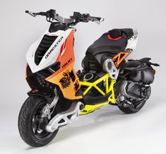 an orange and white motorcycle is parked on a gray background with black tires, the seat has been folded down