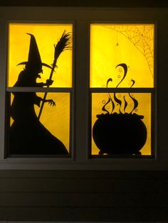 the silhouettes of witches are shown in this window