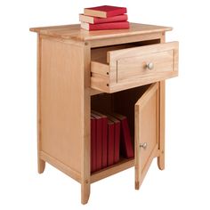 a small wooden table with books on it and a drawer in the middle that is open