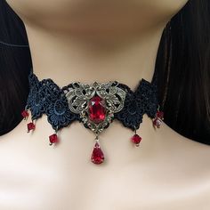 This vintage gothic styled crystal choker necklace features captivating Siam Red Swarovski crystals with nice crisp facets and brass embellishments. The detailed stampings have been in production since the 1940's and the vintage 16x11mm focal crystal is no longer in production, making this necklace a rare find. The lace is double-layered and hand sewn together for extra durability. Both elegant and stylish, this piece would be perfect for any formal occasion. Swarovski Crystals are made in Austr Vintage Red Choker For Party, Vintage Red Metal Choker, Vintage Metal Choker With Jewels, Vintage Red Choker Necklace, Red Vintage Choker Necklace, Handmade Red Vintage Choker, Gothic Costume Jewelry Choker, Elegant Costume Jewelry Choker, Red Gothic Jewelry For Party