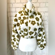 Nwot. Stay Warm And Look Stylish In This Cozy Daisy Sherpa Jacket. The Jacket Features A Collar, Drop Shoulders, Long Sleeves And A Cropped Bodice With A Zipper Closure. Perfect For Everyday Wear. True To Size. Size S - Fits Like A Size 2-4. Trendy Light Olive Green And Cream Never Worn. New Without Tags. White Cozy Outerwear For Spring, Cozy White Outerwear For Spring, Cozy White Spring Outerwear, White Hooded Fleece Jacket For Spring, Trendy Spring Fleece Jacket For Cold Weather, Cozy White Fleece Jacket For Spring, White Fleece Jacket For Cold Spring Weather, White Fleece Jacket For Cold Weather In Spring, Light Olive Green