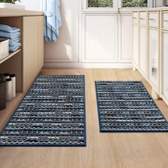 two blue rugs on the floor in a room