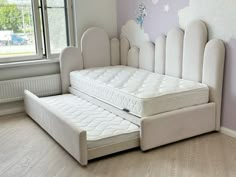 a bed that is in the middle of a room with no mattresses on it