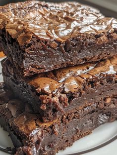 three pieces of chocolate brownie on a plate