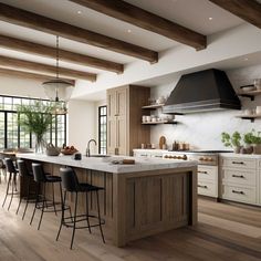 a large kitchen with an island and lots of counter space in front of the stove