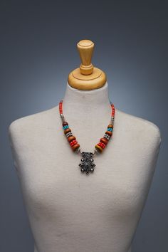 The Berber people are renowned for their unique and intricate jewelry designs, and this antique Amazigh Moroccan necklace is a stunning example of their craftsmanship. The Berber Delight necklace features a series of small, intricately beaded pendants that are strung together on a durable cord. Each pendant is expertly crafted using a combination of glass beads, silver, and other metals, resulting in a truly exquisite piece of jewelry. The Berber Delight necklace is more than just a beautiful pi Bohemian Silver Beads Temple Necklace, Bohemian Silver Beads Temple Necklace As Gift, Artisan Necklace With Oxidized Finish And Round Beads, Spiritual Necklace With Intricate Design For Festivals, Amulet Style Festival Jewelry With Silver Beads, Bohemian Jewelry With Intricate Round Beads, Bohemian Jewelry With Intricate Design And Round Beads, Bohemian Ceremonial Necklaces With Polished Beads, Amulet Necklaces With Silver Beads For Jewelry Making