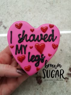 a pink heart shaped cookie that says i shaved my legs brown sugar with hearts on it