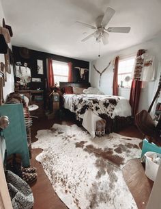 a bedroom with a cow hide rug on the floor