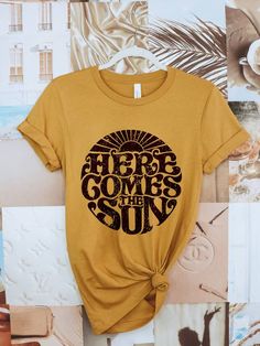 Let the sun into your wardrobe with this beautiful, screen printed tee. Wear it as a reminder to stay positive and enjoy life's little moments. Life is always brighter when you come out of the shadows and into the sunshine! 100% cotton Unisex fit Made in the USA Sun Graphic, Here Comes The Sun, Here Comes, The Sunshine, Retro Design, Black Print, Printed Tees, Retro Inspired, Summer Style