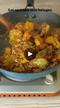 a pan filled with food on top of a stove