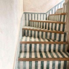 the stairs are striped with green and white stripes