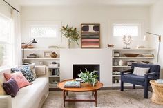 a living room filled with furniture and a fire place