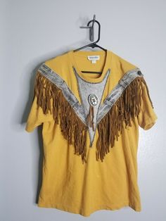 Vintage L GEPETTO 1980'S SouthWest Design Rodeo Yellow Western Fringe T-SHIRT. Condition is preowned with stains see photos Assume that all items were previously owned by a rottweiler who smokes, has a pet cat, and lives in a 100 year old house. Seriously though, we have no idea of the previous life of our products. All items are steam sanitized before shipping which does not always eliminate the prior owners habits. Please launder your item once you receive it- we DO NOT accept returns based on Vintage Festival T-shirt With Crew Neck, Vintage Festival T-shirt With Short Sleeves, Vintage Short Sleeve T-shirt For Festival, 90s Crew Neck Tops For Festivals, 90s Crew Neck Festival Tops, Vintage Short Sleeve Festival T-shirt, 90s Style Festival Tops With Crew Neck, 90s Style Crew Neck Festival Tops, Retro Short Sleeve T-shirt For Festival