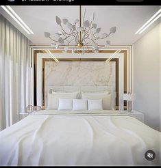 a white bed sitting under a chandelier in a bedroom