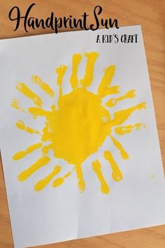 a handprint sun is shown on a piece of paper with the words, a kid's craft