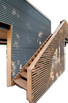 the stairs are made from wood and have slatted metal coverings on them