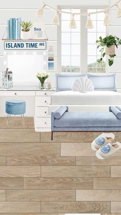 a bedroom with white furniture and blue accents