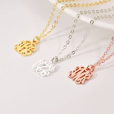 "Dainty Monogram Necklace A monogram pendant is created by using a combination of 3 initials to form a unique symbol tailored to an individual. The monogram is laser cut from a uniform sheet of metal in the initials of your choice.  DETAIL * Material: 925 Sterling Silver / Copper * Color: 100% Silver, Gold, Rose Gold * Chain Type: Cable Chain * Pendant: 10 mm * Chain Length: 14\", 16\", 18\", 20\", 22\" PRODUCTION TIME * All our products are made to order so please allow us to take 6-14 business days to finish your jewelry before shipping out. SHIPPING TIME * UK orders: 3 - 5 business days with standard shipping. It subjects to be longer in holiday season. * Other countries: please check delivery date at check-out, or contact us if you need by a sooner date. MATERIAL * You can choose from White Monogram Necklace For Mother's Day, Classic White Initials Necklace, Monogram Initial Pendant Name Necklace, White Monogram Necklace For Anniversary, White Initial Pendant Necklace With Monogram, Silver Monogram Charm Necklace For Mother's Day, White Initial Pendant Necklace, Monogram Pendant Jewelry For Personalized Gift, Personalized White Initial Pendant Necklace