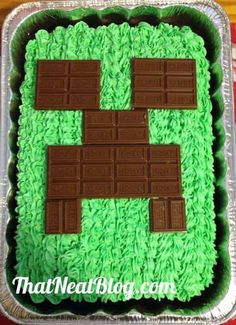 a cake made to look like a video game with green frosting and chocolate squares