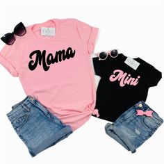 Mama and Mini set of 2 matching tees! Professionally screen printed. Retro style font. MAMA is printed on a standard adult unisex tee made of 100% cotton. Shirt color is Pink. Print color is Black. Fits true to size. Unisex sizing. We recommend ordering the same size you normally wear in an adult unisex shirt. If you want more of a fitted look, order one size down. Refer to Product Images for Size Chart with chest measurements. MINI is printed on your choice of a one-piece bodysuit for baby or a Cute Cotton T-shirt With Name Print, Fun Letter Print Tops For Family Occasions, Cute Pink T-shirt With Funny Text, Cute Family Shirt With Letter Print, Cute Family Shirt With Name Print, Unisex Family Matching T-shirt With Screen Print, Matching Family Cotton T-shirt, Cotton T-shirt With Text Print, Trendy Pink T-shirt With Name Print