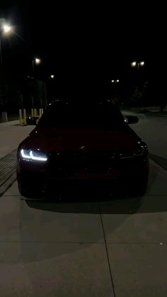 a car parked on the street at night