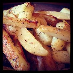 cooked potatoes with seasoning on top in a blue bowl