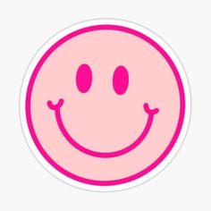 a pink smiley face sticker with two eyes and one smile on it's face