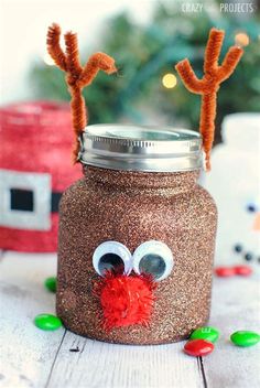 a mason jar decorated to look like a reindeer