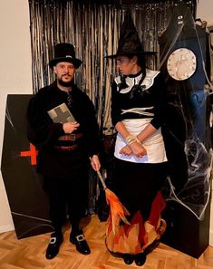 two people dressed in costumes standing next to each other