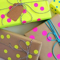 presents wrapped in brown paper with colorful polka dots and twine tied around the edges