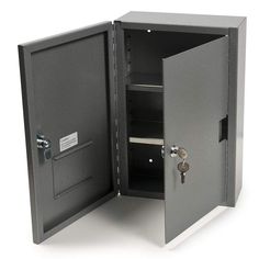 an open safe box with the door closed and key in it's side compartment