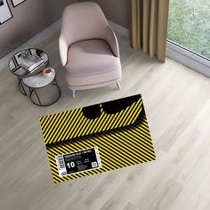 a living room with a chair, table and card board on the floor in front of a window