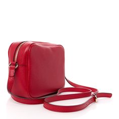 This is an authentic GUCCI Pebbled Calfskin Small Soho Disco Bag in Tabasco Red. This stylish crossbody bag is crafted of textured calfskin leather in red. This shoulder bag features an adjustable leather shoulder strap, a stitched interlocking GG logo, and a polished brass knobbed leather tassel zipper pull. The top unzips to a natural fabric interior with a patch pocket. Soho Disco Bag, Gg Logo, Natural Fabric, Leather Tassel, Natural Fabrics, Polished Brass, Soho, Patch Pocket, Calf Skin