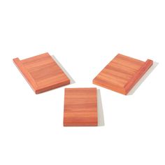 three square wooden coasters sitting on top of each other