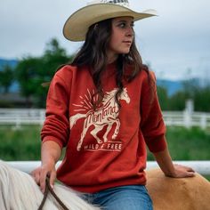 Look wild and be free in this chic Wild & Free Unisex Pullover! Featuring a horse rearing up in all her majestic glory, this pullover will make you feel like a cowboy with a perfect blend of rustic style and modern fashion. Ride off into the sunset in style!Body Length: S-27", M-28", L-29", XL-30", 2X-31"Chest Width: S-20", M-22", L-23.5", XL-25.5", 2X-27" A Montana Scene Original Design. All designs are property of The Montana Scene. All rights reserved. All of The Montana Scene apparel is desi Free-spirited Long Sleeve Tops For Fall, Country Style Tops For Fall Country Events, Long Sleeve Top For Ranch In Fall, Long Sleeve Tops For Western-themed Fall Events, Western Style Crew Neck Tops For Fall, Relaxed Fit Top For Western-themed Fall Events, Relaxed Fit Tops For Western-themed Fall Events, Horse Rearing, Wild Free