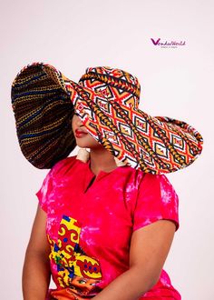 Turn heads and elevate your style with our Massive Oversized Floppy Ankara Print Sun Hat. Designed to offer both shade and a bold fashion statement, this hat combines traditional African Ankara prints with a modern, oversized silhouette. Crafted from high-quality, breathable fabric, it provides comfort and flair, making it the perfect accessory for beach days, garden parties, or any sunny day outing. Its wide brim not only protects you from the sun but also adds an effortless touch of elegance t Festival Panama Hat With Wide Brim, Festival Wide Brim Panama Hat, Multicolor Sun Hat For Beach, Multicolor One Size Beach Sun Hat, Traditional Flat Brim Sun Hat For The Beach, Multicolor Fedora Panama Hat, Traditional Fedora Sun Hat For Vacation, Multicolor Wide Brim Panama Hat For Festivals, Traditional Wide Brim Panama Hat For Vacation