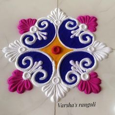 an intricate design on the floor in white and blue colors with pink, yellow and red accents