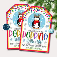 two christmas gift tags with penguins on them