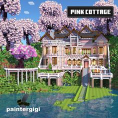 the pink cottage is surrounded by trees and flowers in front of a body of water