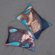 two pillows with an image of a naked man on them