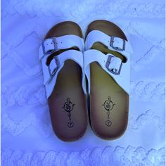 Size 7 Women’s Cute And Comfy - Perfect Condition Never Worn Comfortable White Slip-on Sandals, White Slides With Cork-bed Midsoles For Spring, White Flip Flops With Buckle Closure For Summer, White Flat Heel Synthetic Footbed Sandals, Summer White Flip Flops With Buckle Closure, White Flip Flops With Buckle Closure, White Synthetic Flat Heel Footbed Sandals, White Buckle Closure Flip Flops With Round Toe, White Buckle Closure Round Toe Flip Flops