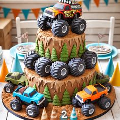 a birthday cake with monster trucks on top