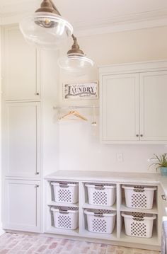 the laundry room is clean and ready to be used as a storage space for clothes